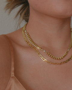gold filled curb chain necklace with CZ stone details layered with a medium gold plated mariner chain