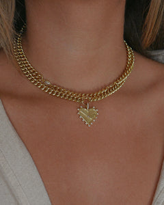 thick gold curb chain with oversized heart pendant