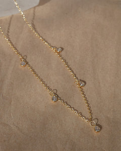 dainty gold necklace with cubic zirconia pear shaped charms