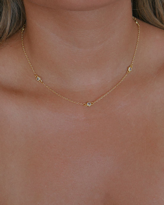dainty gold necklace with satellite cubic zirconia bezel set stones