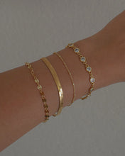 Load image into Gallery viewer, gold bezel set cubic zirconia bracelet stack idea
