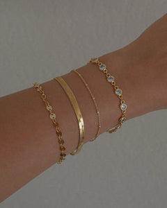 gold bezel set cubic zirconia bracelet stack idea